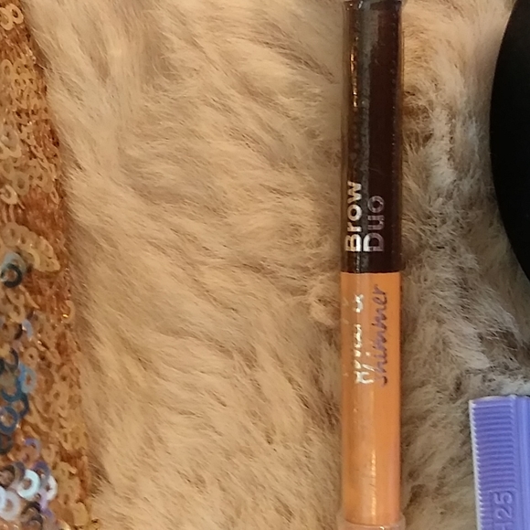 Gold Victoria's secret bag filled with a variety of beauty products. - Picture 11 of 13